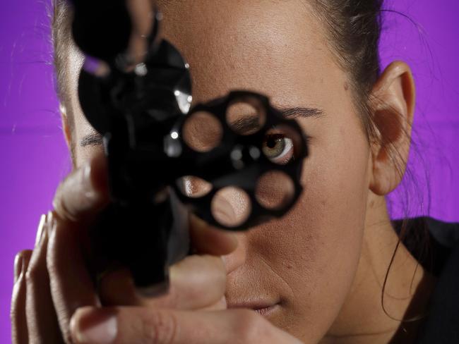 Feature on NSW Police use a ballistics system dubbed IBIS to analyse guns, bullets and shells to help trace them to shootings and unsolved crimes. Ballistics support officer Elise Castronini looks through the barrel of a 44 Magnum Smith and Wesson. Picture: Toby Zerna