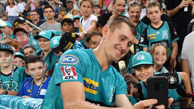 Marnus Labuschagne poses for a selfie with Brisbane Heat fans.