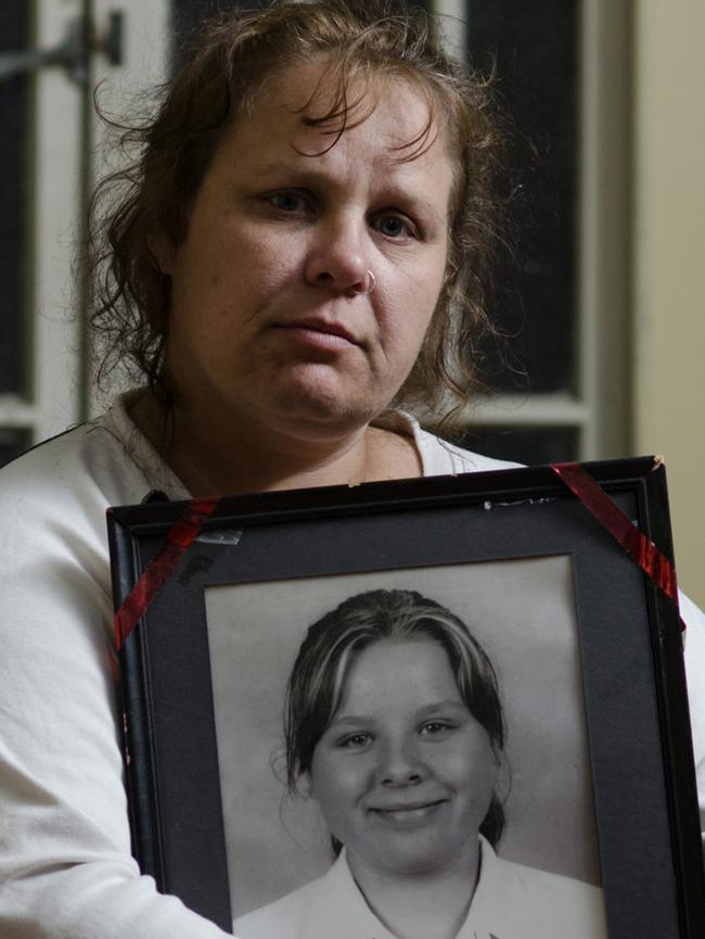 Cindy McNulty with a picture of her daughter Felicia Goodson who suicided.