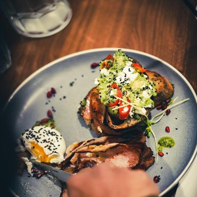 Smashed avo with eggs and bacon breakfast at Durbar.