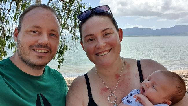 Ashlee and Adam Holstein with their newborn son, Mars.