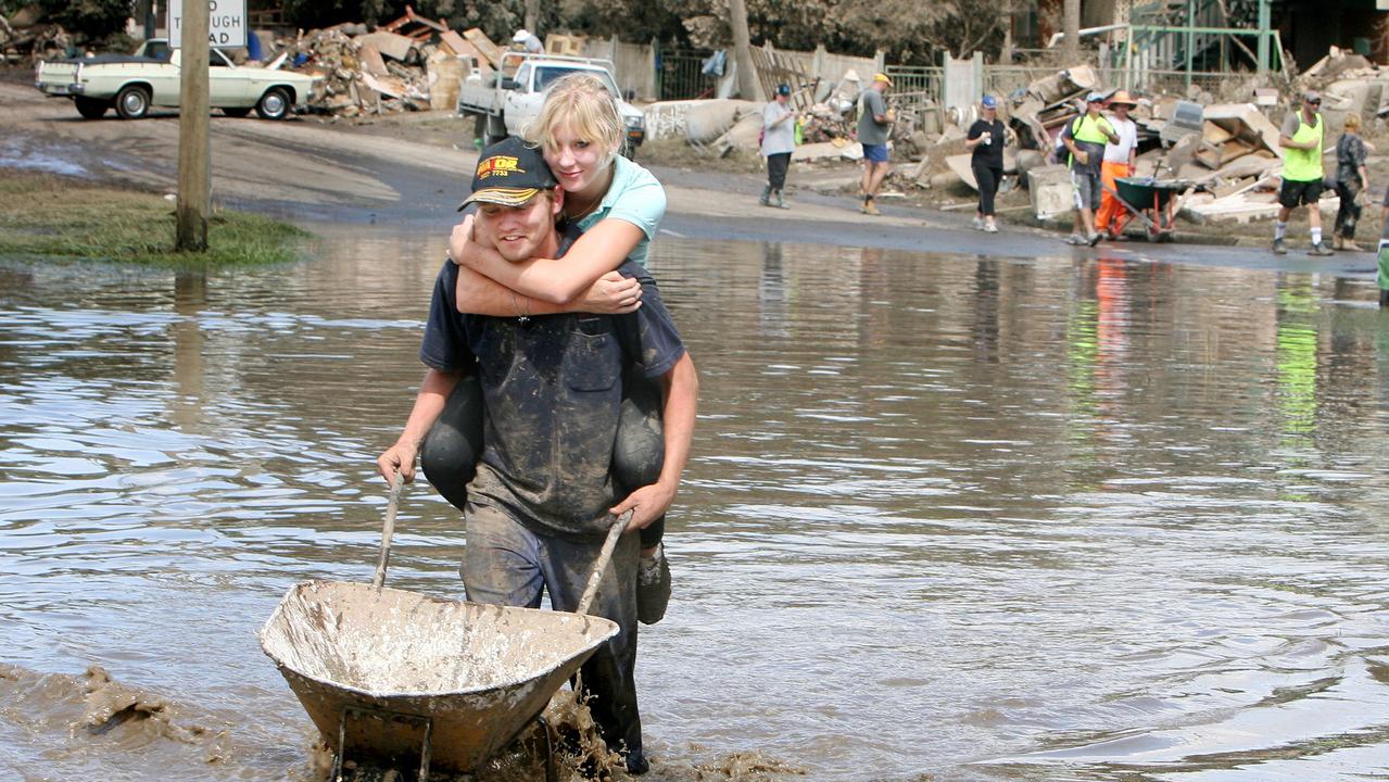 Volunteers Daniel Borowski and his girlfriend Vanessa Harrison helping with the flood clean up at Mill St, Goodna. Photo: Sarah Harvey/ The Queensland Times