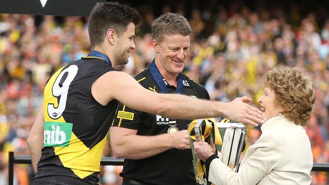 Maureen Hafey presents Trent Cotchin and Damien Hardwick with the premiership trophy. Picture: Michael Klein.