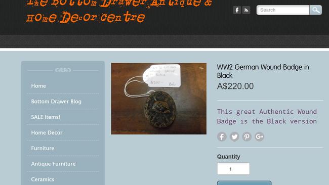 An authentic wound badge featuring the swastika symbol is being sold at the shop.