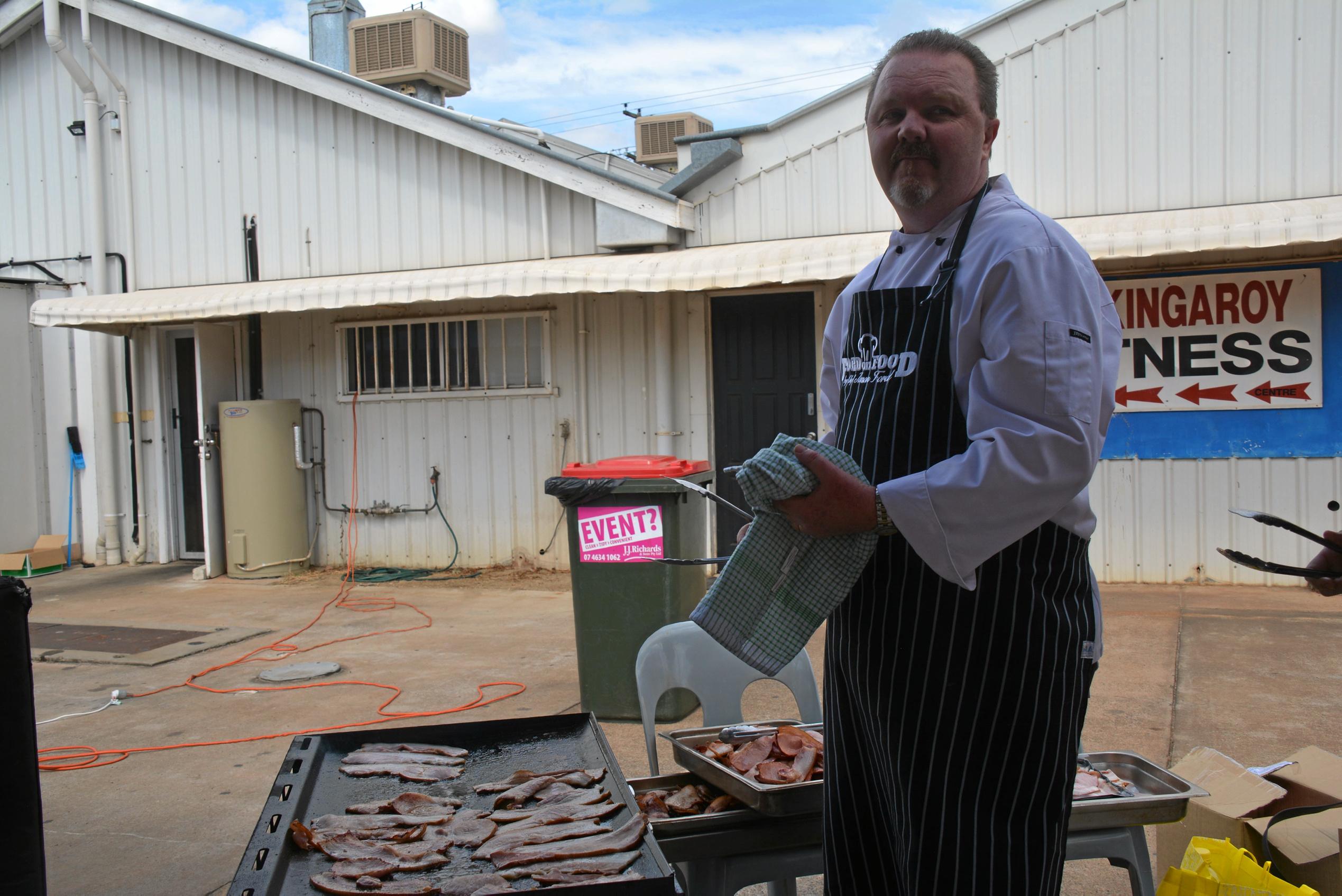 South Burnett Food Ambassador Jason Ford preparing the bacon for the bacon eating competition during Kingaroy's BaconFest on Saturday August 25. Picture: Jessica McGrath