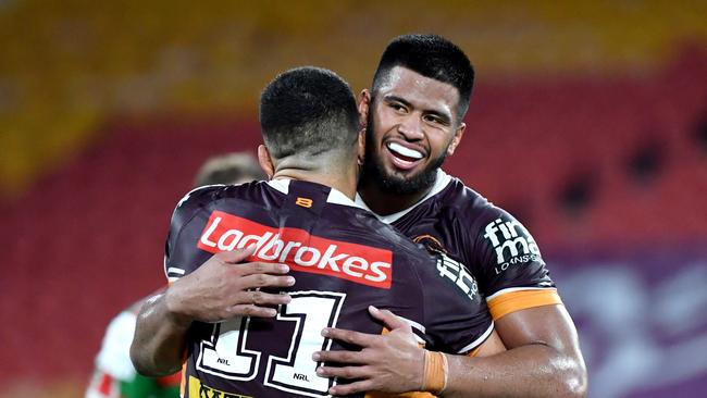 David Fifita (left) and Payne Haas (right) of the Broncos celebrate winning the round two NRL match between the Brisbane Broncos and South Sydney Rabbitohs at Suncorp Stadium in Brisbane, Friday, March 20, 2020. (AAP Image/Darren England)