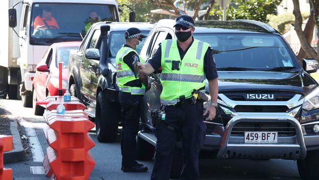 Police and Emergency Services stop members of the public on the border for questioning. Picture Glenn Hampson