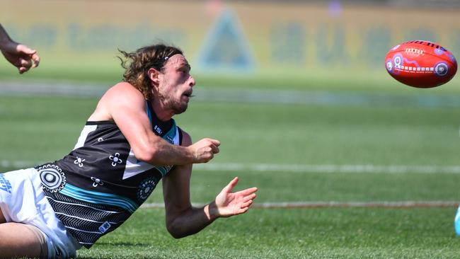 Jarrod Lienert fires off a handpass at Jiangwan Stadium, Shanghai. Picture: AAP Image/David Mariuz