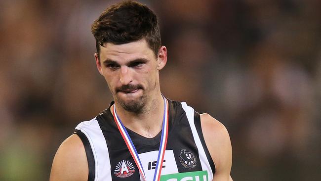 MELBOURNE, AUSTRALIA - APRIL 25: Best afield Scott Pendlebury of the Magpies looks on after he was jeered by Bombers fans on receiving his medal during the round 6 AFL match between Essendon and Collingwood at Melbourne Cricket Ground on April 25, 2019 in Melbourne, Australia. (Photo by Michael Dodge/Getty Images)