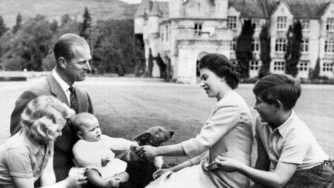 In this picture taken on September 8, 1960, Queen Elizabeth II and Prince Philip sit at Balmoral with their children Princess Anne, Prince Charles and the newborn Prince Andrew. Picture: AFP Photo