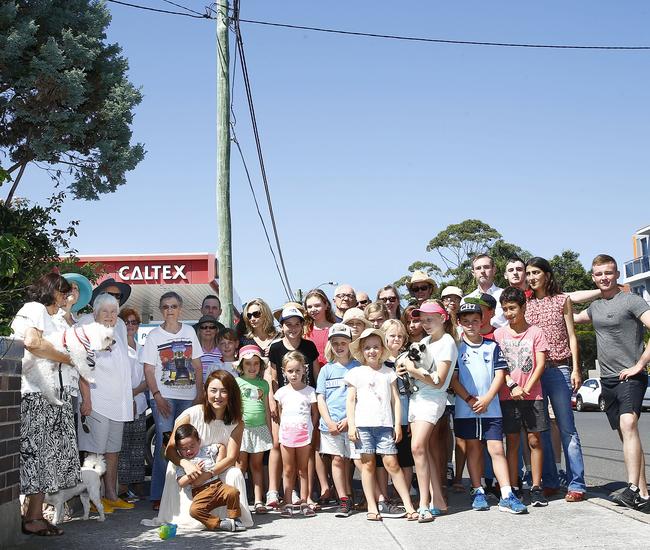 Concerned residents gather in front of the pole where the proposed mobile base station will go. Picture: John Appleyard