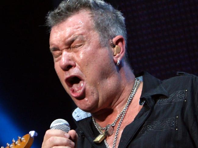 Guitarist Ian Moss (L) and singer Jimmy Barnes during performance of the band Cold Chisel at the Sydney Telstra 500 V8 Supercars race at Sydney Olympic Park, Homebush.