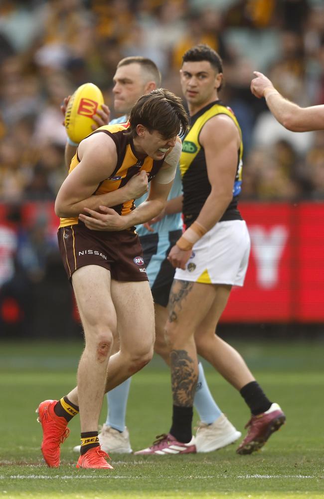 Will Day hunches over after colliding with teammate Jai Newcombe. Picture: Darrian Traynor/Getty Images.