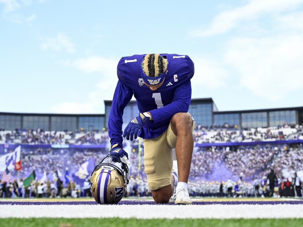 Rome Odunze of the Washington Huskies kneels on the field before the game against the Utah Utes at Husky Stadium in Seattle, Washington. Picture: Alika Jenner/Getty Images