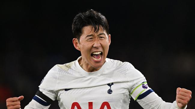 Son Heung-Min celebrates after scoring the sealer. (Photo by Glyn KIRK / AFP)