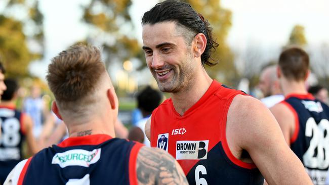 MELBOURNE, AUSTRALIA - AUGUST 27: Brodie Grundy of the Demons speaks with James Harmes after winning the 2023 VFL Wildcard Round match between the Casey Demons and the North Melbourne Kangaroos at Casey Fields on August 27, 2023 in Melbourne, Australia. (Photo by Josh Chadwick/AFL Photos via Getty Images)