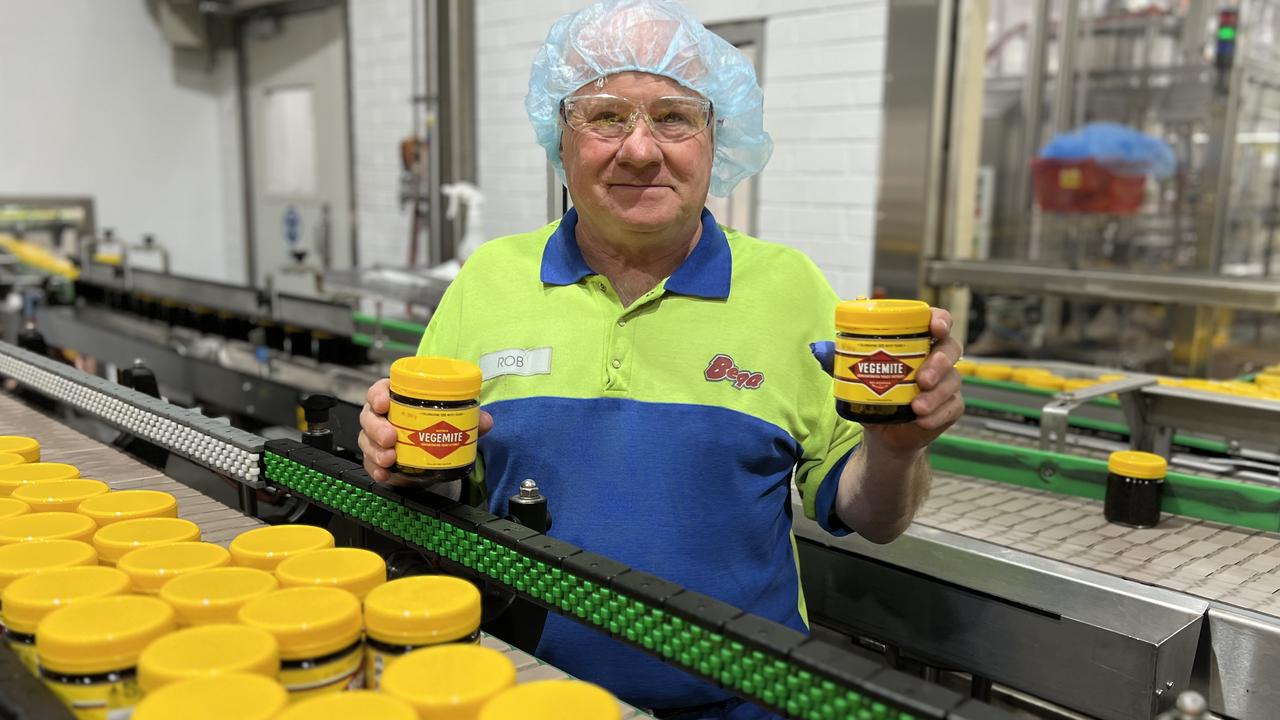 Rob Carman, who has worked for Vegemite for 51 years, with the limited edition jars as they rolled off the production line. Picture: Vegemite.