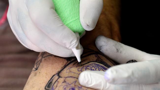 Shock research warns that tattoo ink can cause cancer, with one colour more  dangerous than the others  — Australia's leading news site