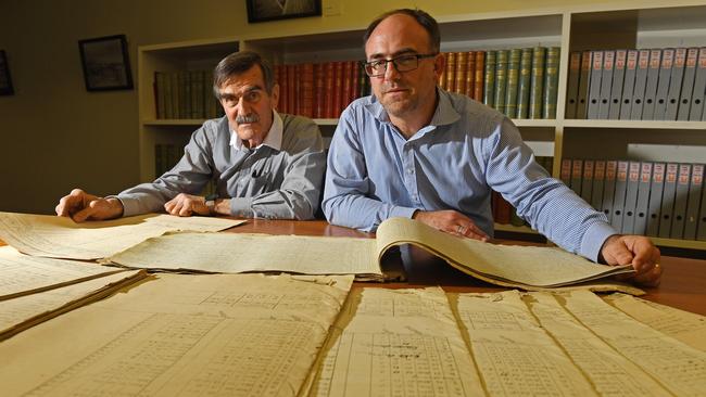 Citizen scientist Mac Benoy and SA’s National Archives director Nick Gleghorn examining the weather diary at the State Library. Picture: Tom Huntley