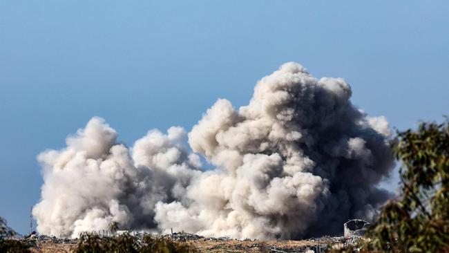 Heavy smoke billows over the Gaza Strip during Israeli bombardment on Thursday. Picture: AFP