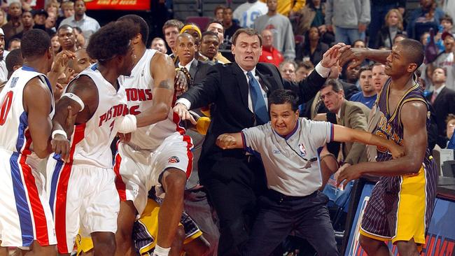 Ben Wallace and Ron Artest are separated before the fight spilled into the crowd.