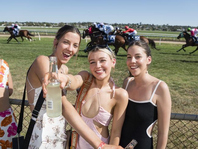 At Warwick Cup race day are (from left) Mackenzie Rutledge, Bridgette Harland and Jada Rutledge at Allman Park Racecourse, Saturday, October 14, 2023. Picture: Kevin Farmer