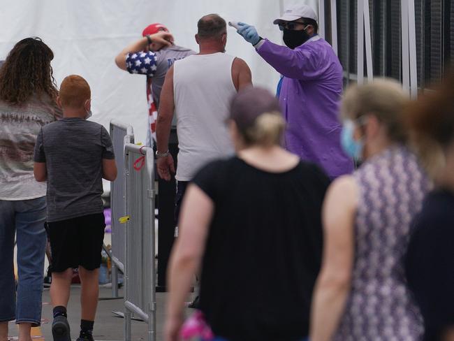 Attendees are body temperature screened prior to a political rally for President Donald Trump. Picture: AFP