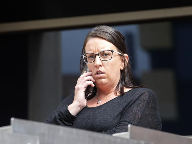 Melissa Oates leaves the Hobart magistrates Court.