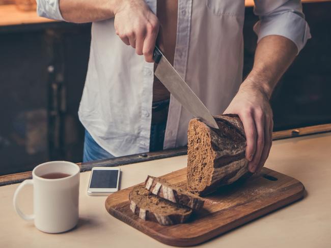 Good technique, but this bloke lets himself down by the fact he’s not actually using a serrated bread knife. Picture: istock
