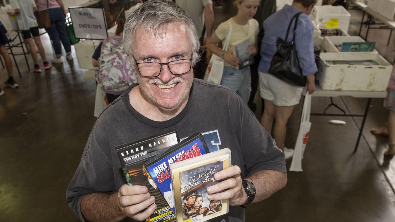 Showing some of the bagful of bargain DVDs he picked up at Lifeline BookFest is Grant Orford. The Chronicle Lifeline BookFest at Toowoomba Showgrounds. Saturday, March 4, 2023. Picture: Nev Madsen.