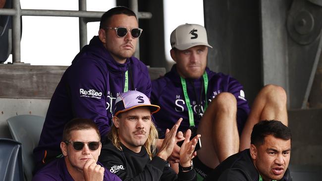 MELBOURNE . 12/02/2023.  NRL. Trial game. Melbourne Storm vs Sydney Roosters at Kardinia Park.  Injured Storm players Ryan Papenhuyzen, Harry Grant and Cam Munster watch on from the stands  . Pic: Michael Klein