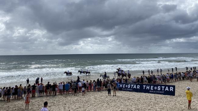 Crowds line the beach for the gallop. Picture: Jacob Miley.