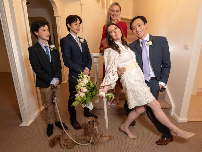 Bride Amanda Thorpe and Groom Keith Ing with sons Dylan (19), Bailey (14) and Ryder the dog, married at 11.59pm. Picture: Tony Gough