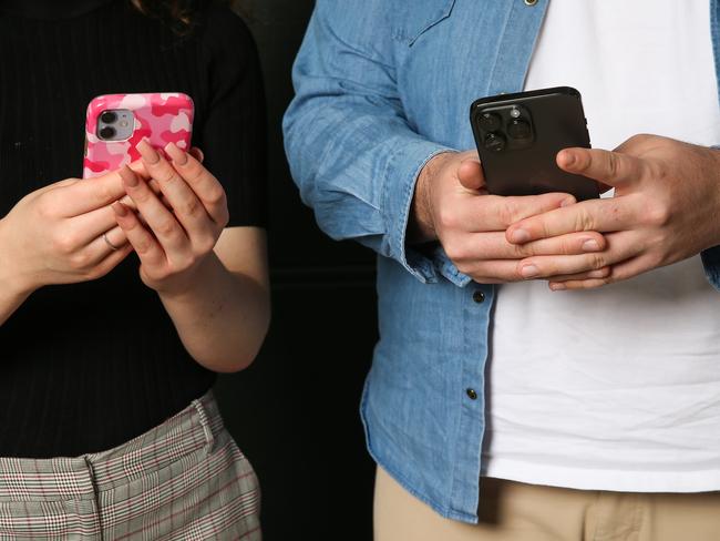 SYDNEY, AUSTRALIA : Newswire Photos AUGUST 28 2023: Patrick Blacker and Aaliyah Johnston, both 20, in Sydney with their phones. A case study on Gen Z and their phone use and why they prefer to text rather than speak on the phone. Picture: NCA Newswire/ Gaye Gerard