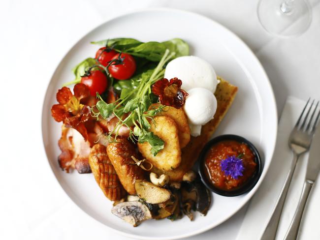 The all-day Mega Breakfast includes free range eggs, roasted tomatoes, pan seared mushrooms, crispy house made toast, chipolatas, bacon, spinach and hash browns. Picture: MATT THOMPSON