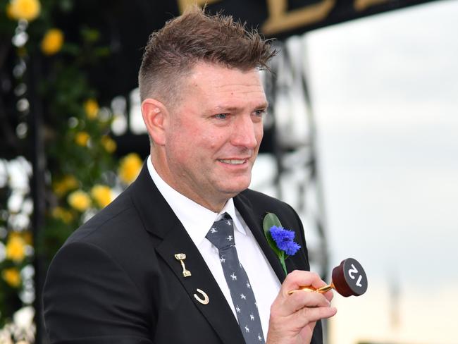 Darren Thomas is seen drawing barrier 12 for  Rostropovich during the 2019 Melbourne Cup Barrier Draw at Flemington Racecourse in Melbourne, Saturday, November 2, 2019. (AAP Image/Vince Caligiuri) NO ARCHIVING, EDITORIAL USE ONLY