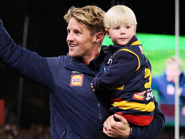 ADELAIDE, AUSTRALIA - MAY 02: Rory Sloane of the Crows with his sons Sonny and Bodhi on his lap of honour during the 2024 AFL Round 08 match between the Adelaide Crows and the Port Adelaide Power at Adelaide Oval on May 02, 2024 in Adelaide, Australia. (Photo by James Elsby/AFL Photos via Getty Images)