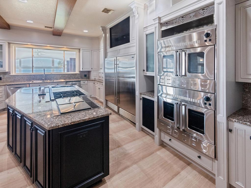 The kitchen now looks more sleek, with white paint instead of a pastel yellow. Picture: Christian Pestana Rodriguez