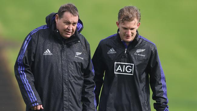 All Blacks coach Steve Hansen talks with Damian McKenzie in Auckland.