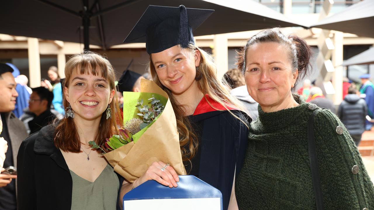 Deakin graduate Sinead Meihuizen with friend Ruby Grujic and mum Prue Beirne. Picture: Alison Wynd