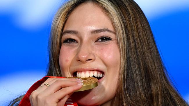 Eileen Gu celebrates on the podium after claiming a gold medal. Picture: AFP