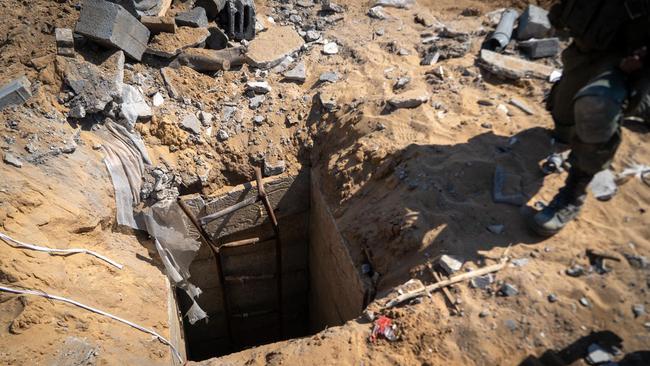 This handout picture released by the Israeli army reportedly shows Israeli soldiers at the entrance of a tunnel in the Gaza Strip. Picture: AFP