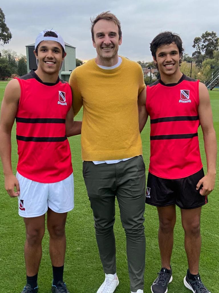 Jayden Davey (right) with twin brother Alwyn Davey and Bombers champ Jobe Watson.