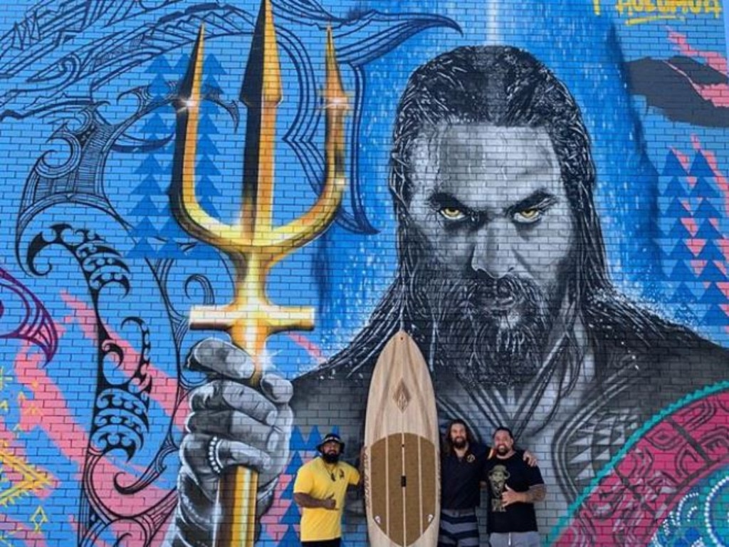 Jason Momoa post at Burleigh Heads: Honored and proud to be back on the Gold Coast incredible artwork by @art_by_ezra @mattybro_art to honor Aquaman and my Polynesian heritage