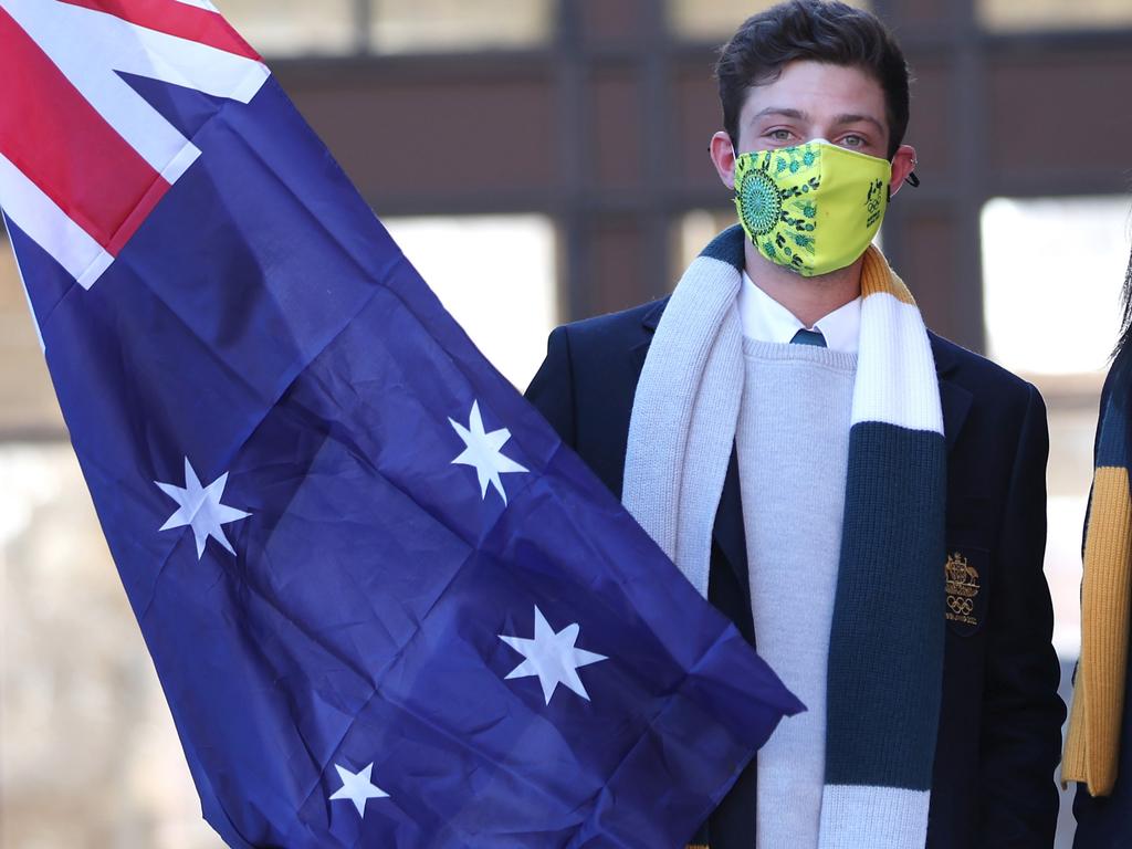 Figure skater Brendan Kerry with the national flag during Australia's opening ceremony flag bearers announcement in 2022. Picture: Maja Hitij/Getty Images