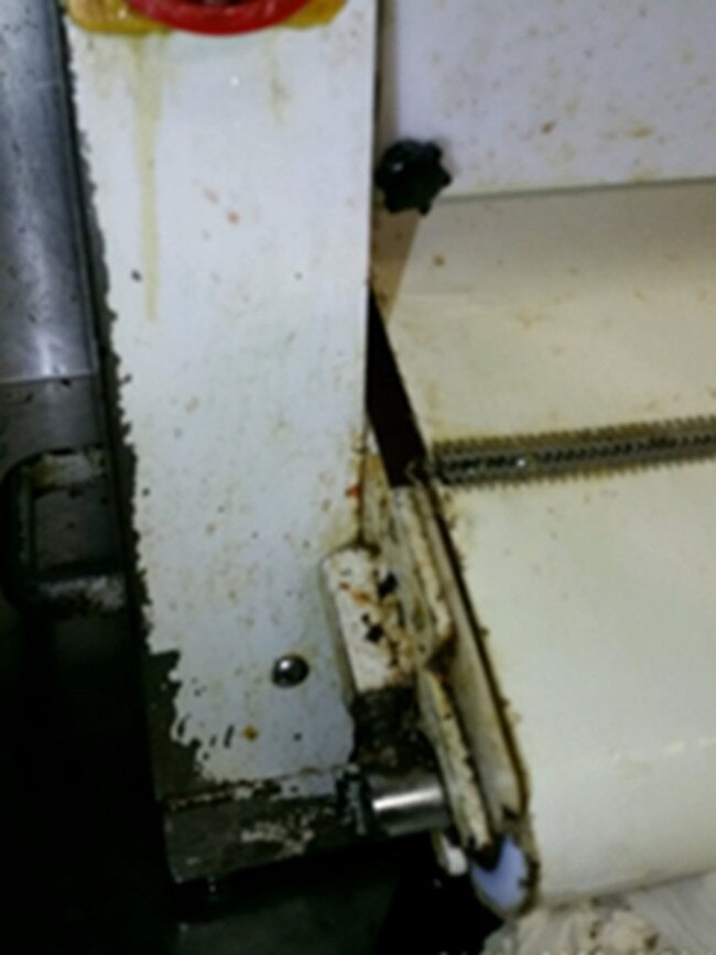 Built up dirt and food residue was also seen inside a pizza dough rolling machine.