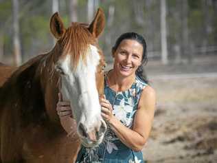 COUNTRY LIFE: Centre manager of Country Universities Centre Clarence Valley Melanie Lamb with one of her horses. Picture: Adam Hourigan