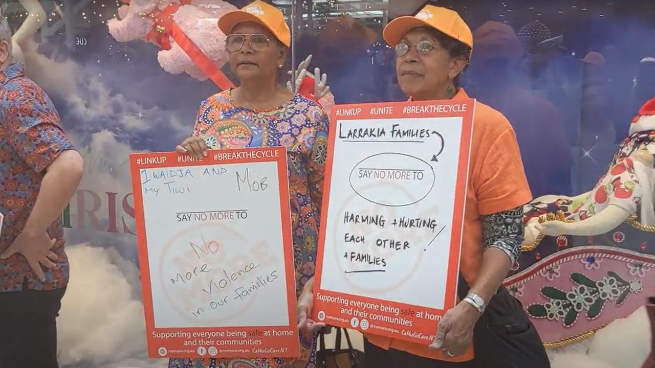 Territorians made and raised signs to raise awareness of family and domestic violence in the NT. Picture: Zizi Averill