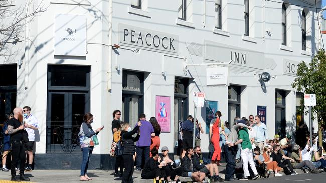 Crowds of people gather on High Street in Northcote at the weekend. Picture: Andrew Henshaw