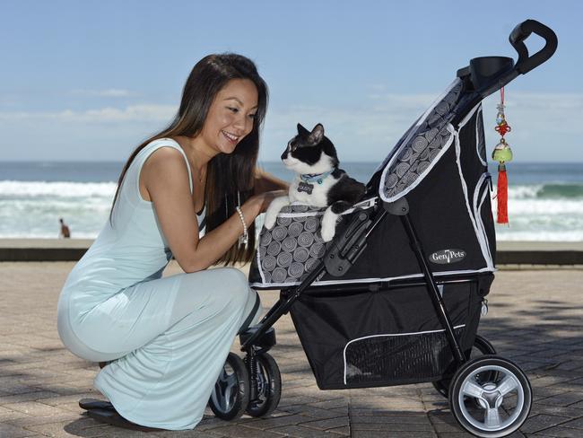 Valerie Nguyen catching some quality time with her cat Dusty. Picture: Troy Snook